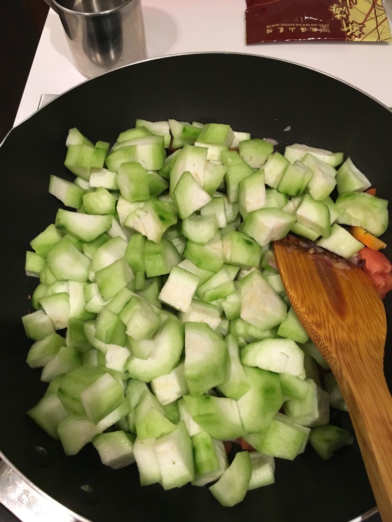 Peeled and chopped ridge gourd in the pan